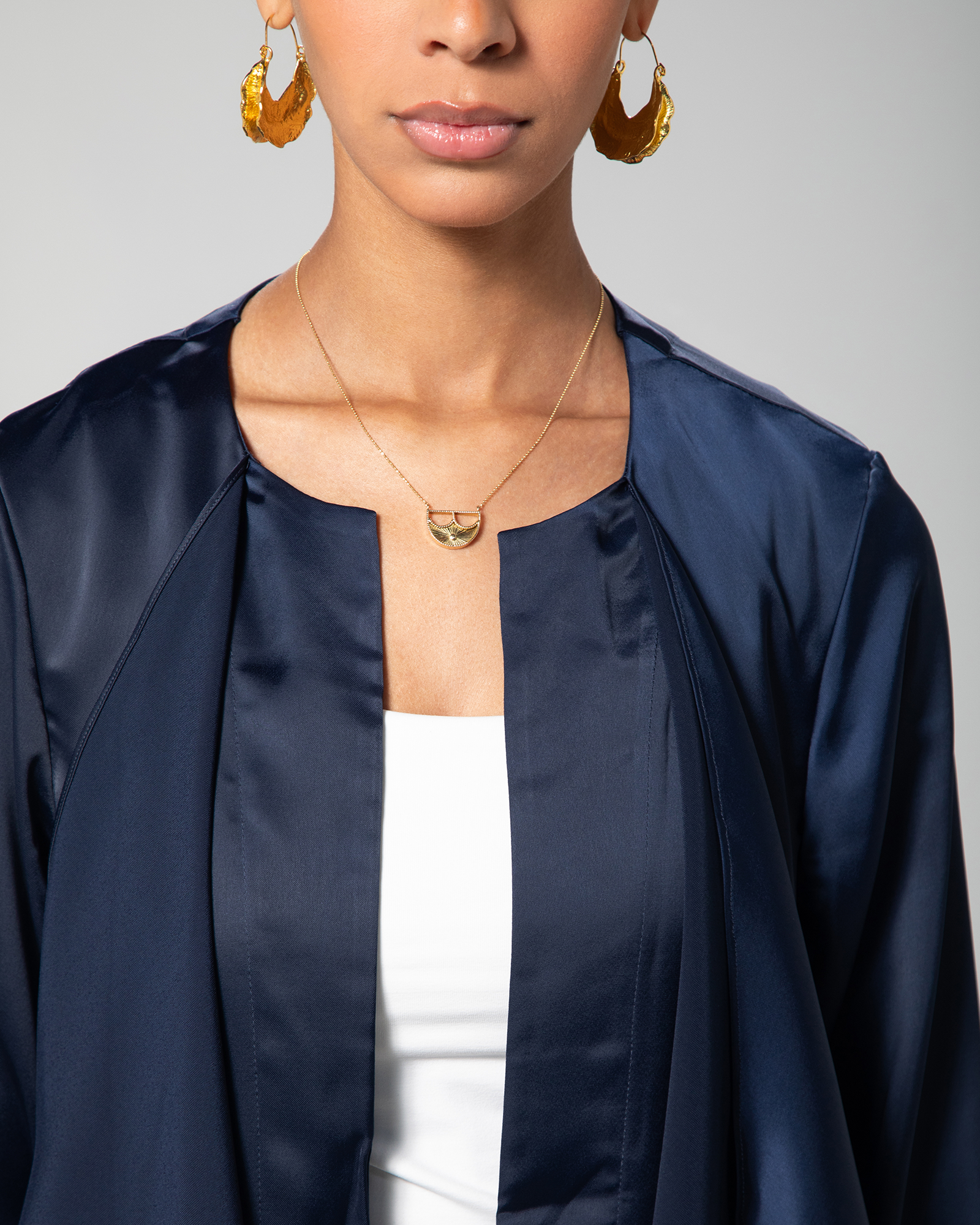 Detailed close-up of the collar and lapel of Omni The Label’s navy cover-up, emphasizing the soft fabric and structured drape KSA UAE Qatar