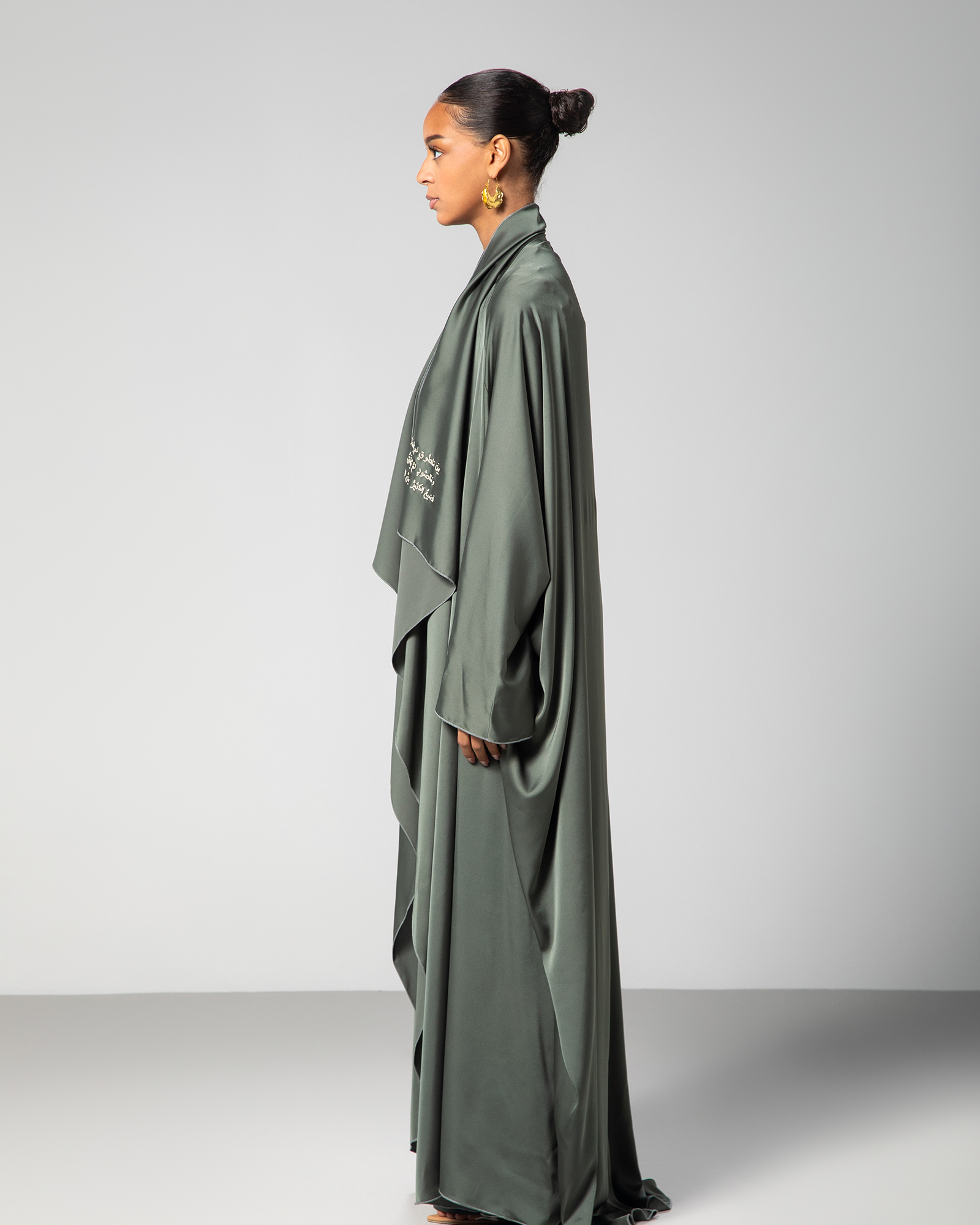 Side profile of Flow Abaya highlighting sleeve detail and relaxed fit – UAE, KSA, Qatar
