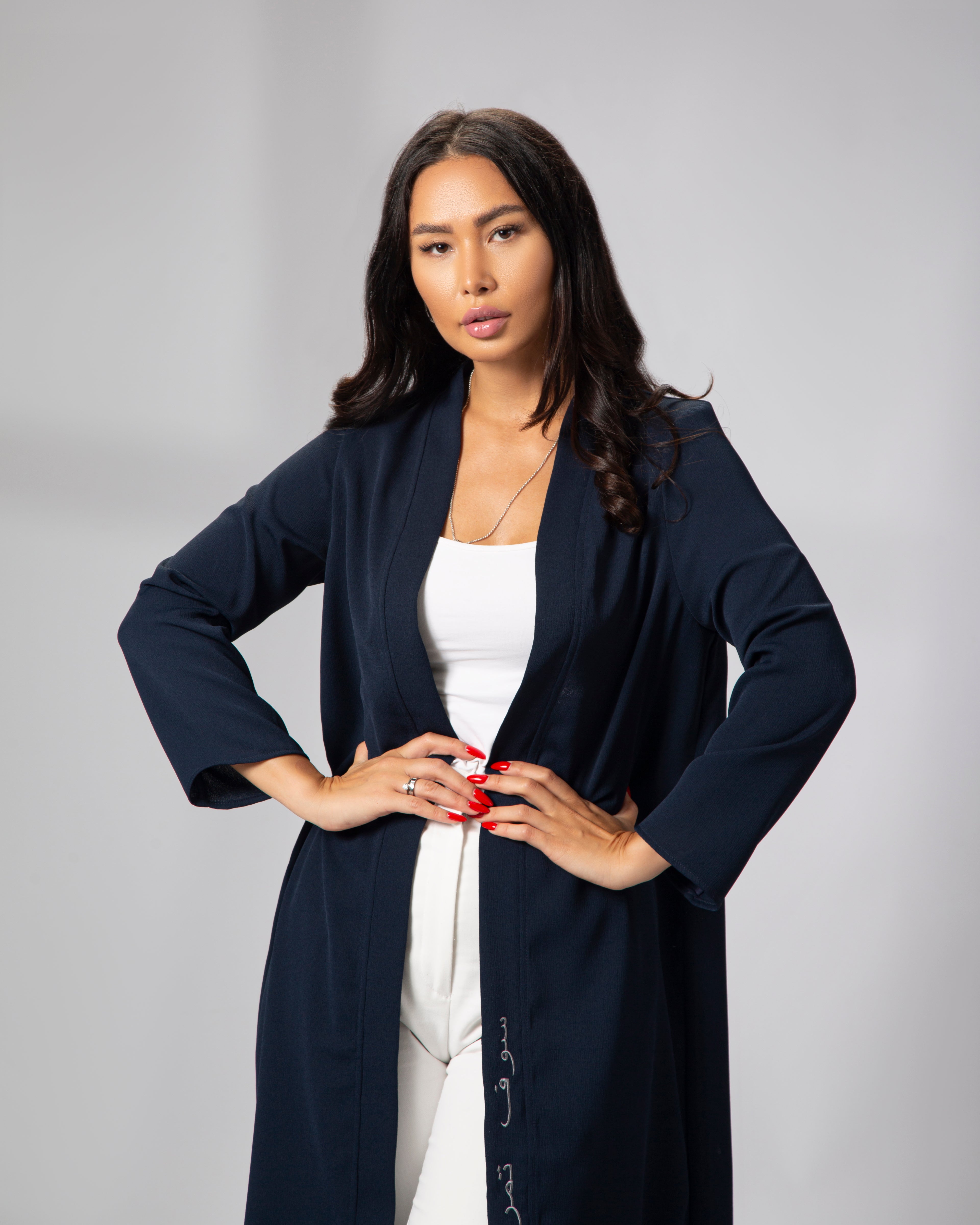 Close-up of the navy blue kimono, showing embroidery detail on front left panel and open sleeve cut KSA UAE Qatar