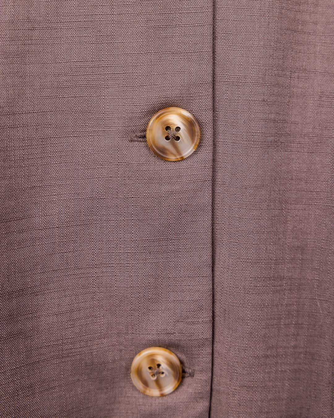 Button-down front of brown skirt from Omni The Label, capturing refined style trends Qatar KSA UAE