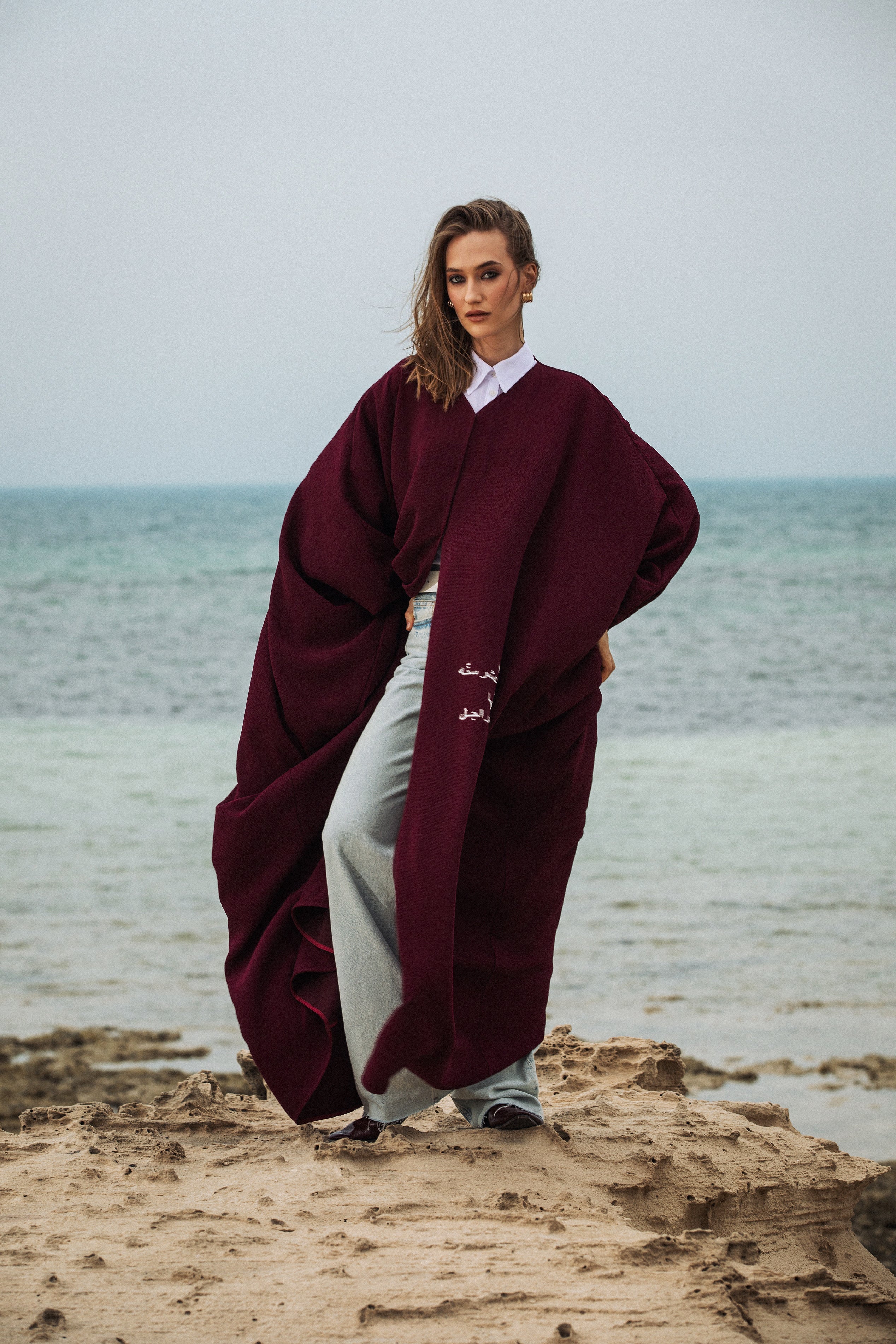 Qatar National Day Abaya styled on beach with wind-swept silhouette – UAE, KSA, Qatar
