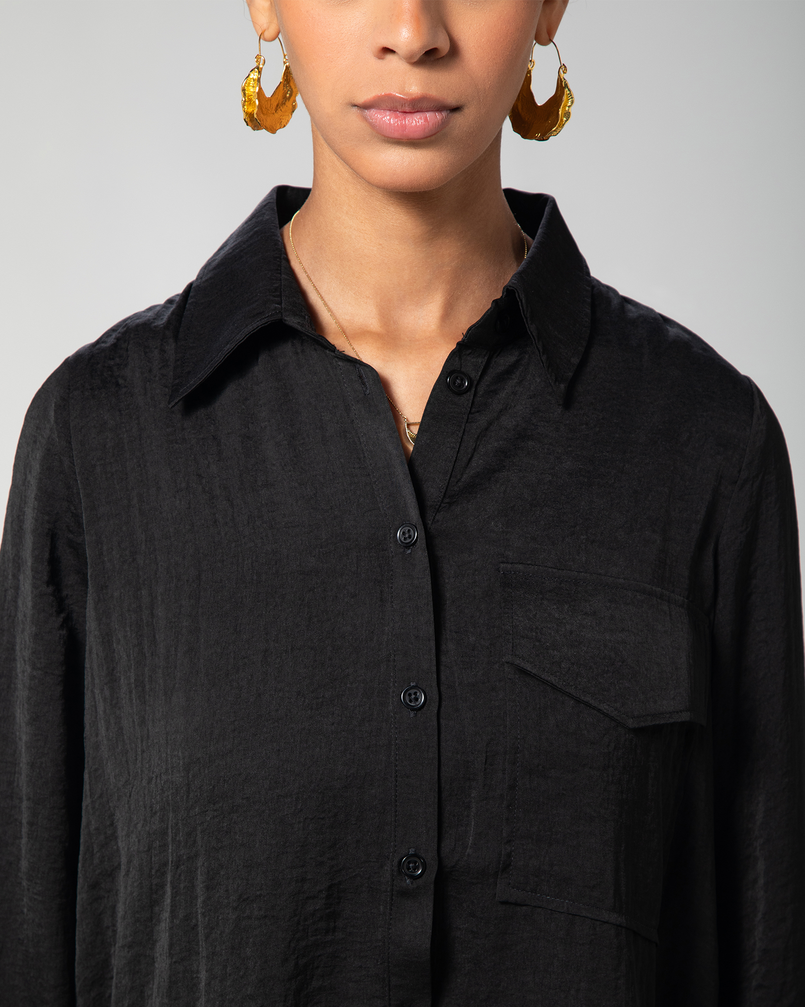 Detail view of the shirt’s front collar and buttons by Omni The Label – UAE, KSA, Qatar