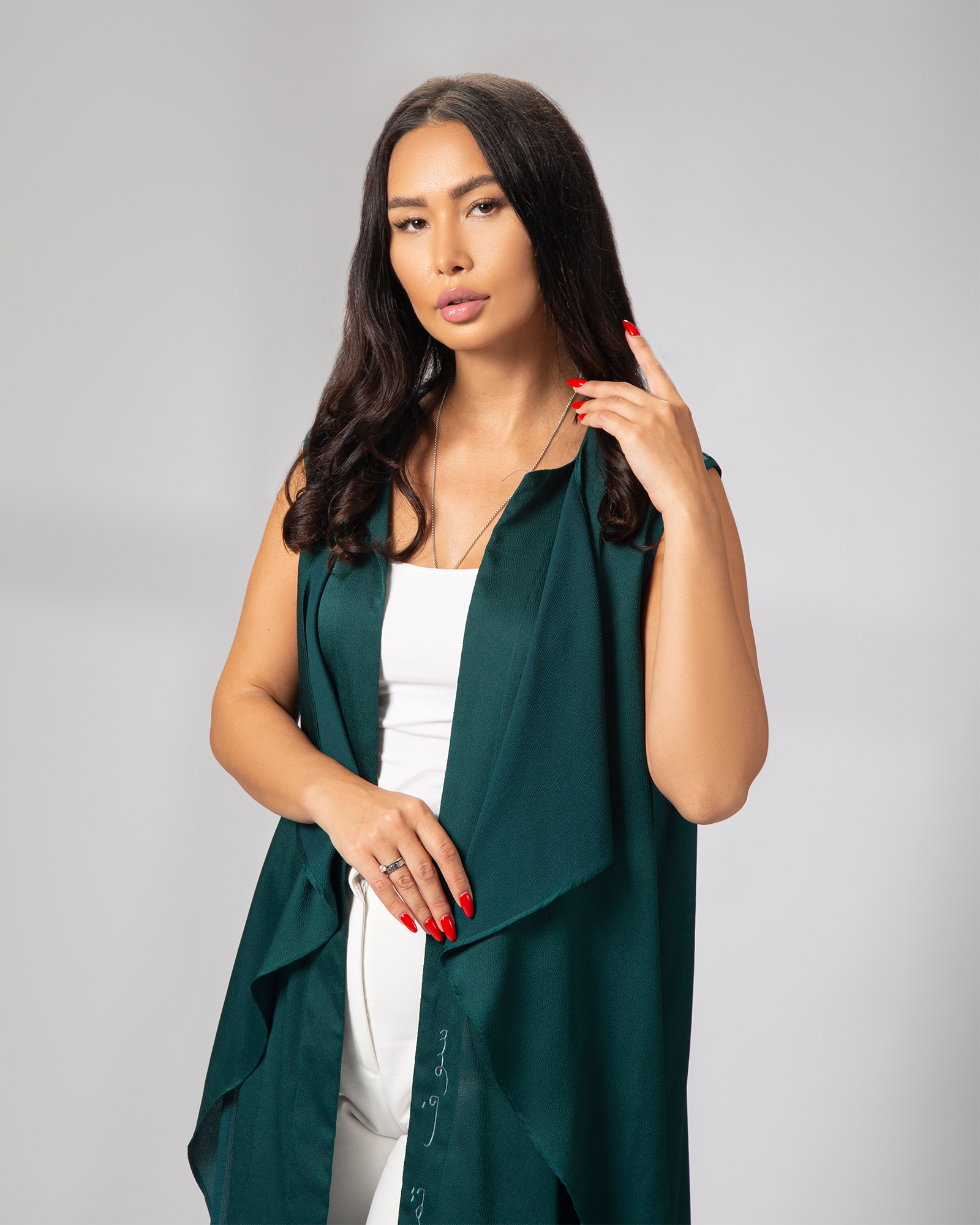 Front close-up of Arabic embroidery on green sleeveless cover-up, lightweight and elegant – UAE, KSA, Qatar
