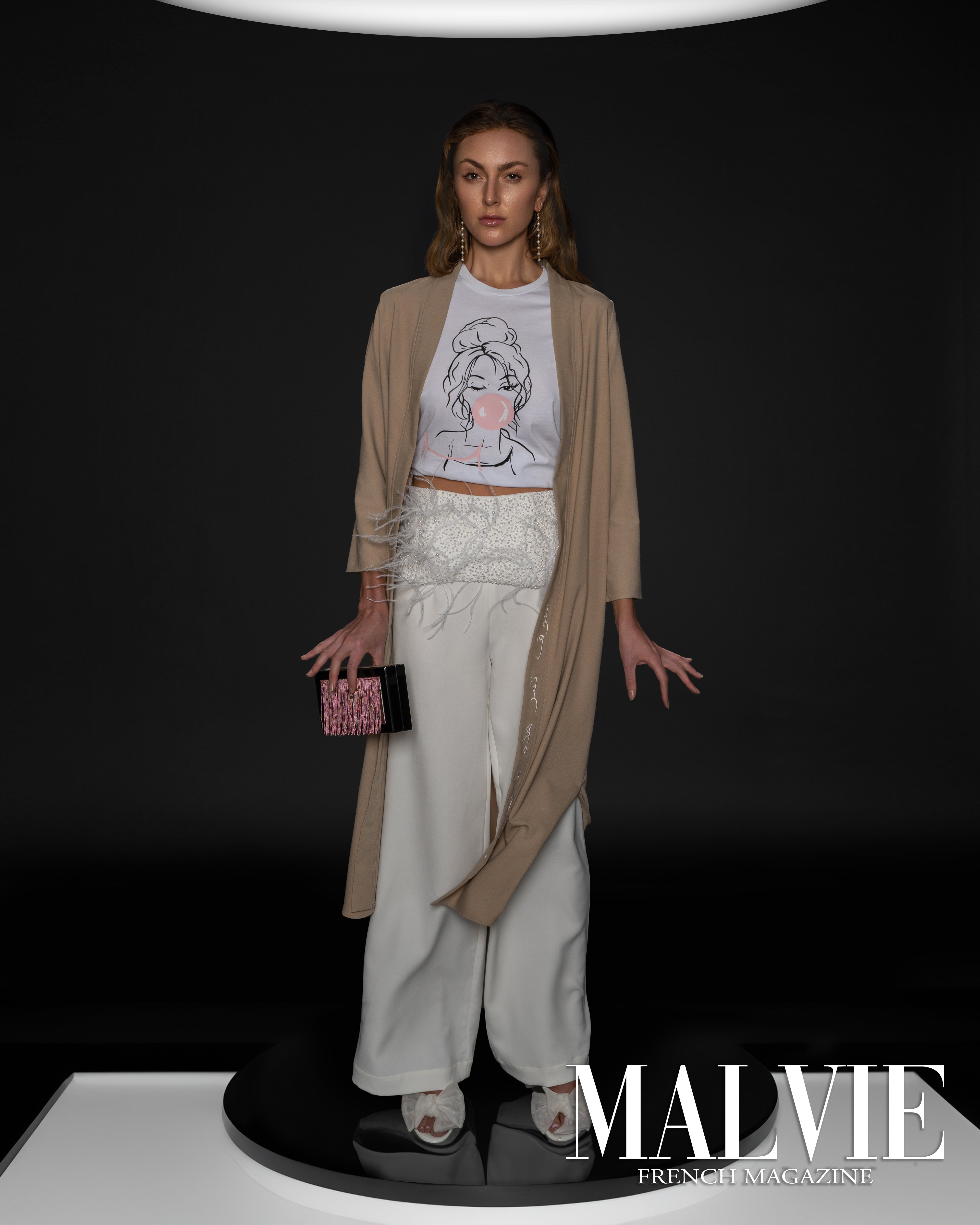 Model on runway in nude kimono by Omni The Label with Arabic embroidery, elegant and minimal