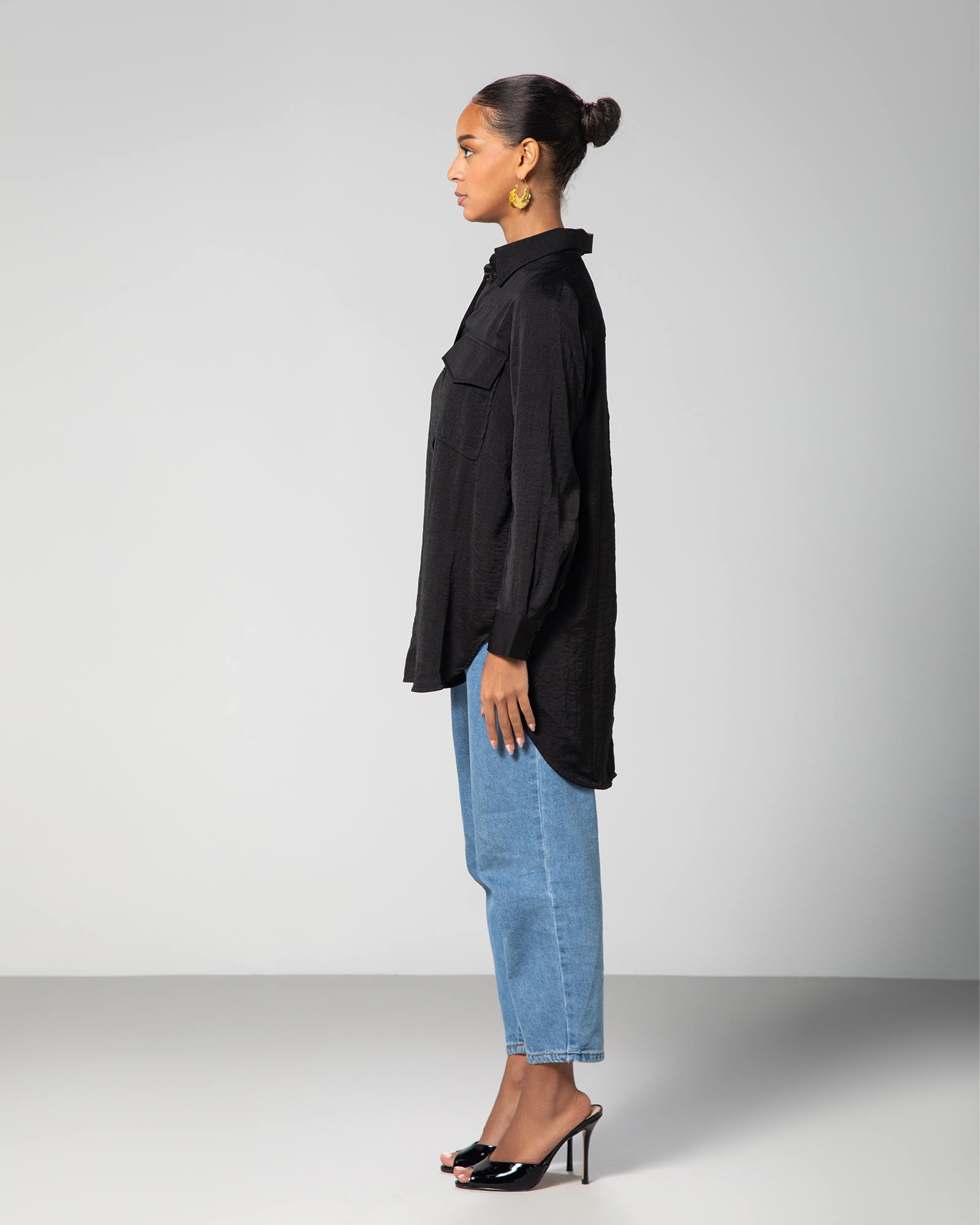 Side angle of the black collared shirt with contemporary long-back cut by Omni The Label – UAE, KSA, Qatar