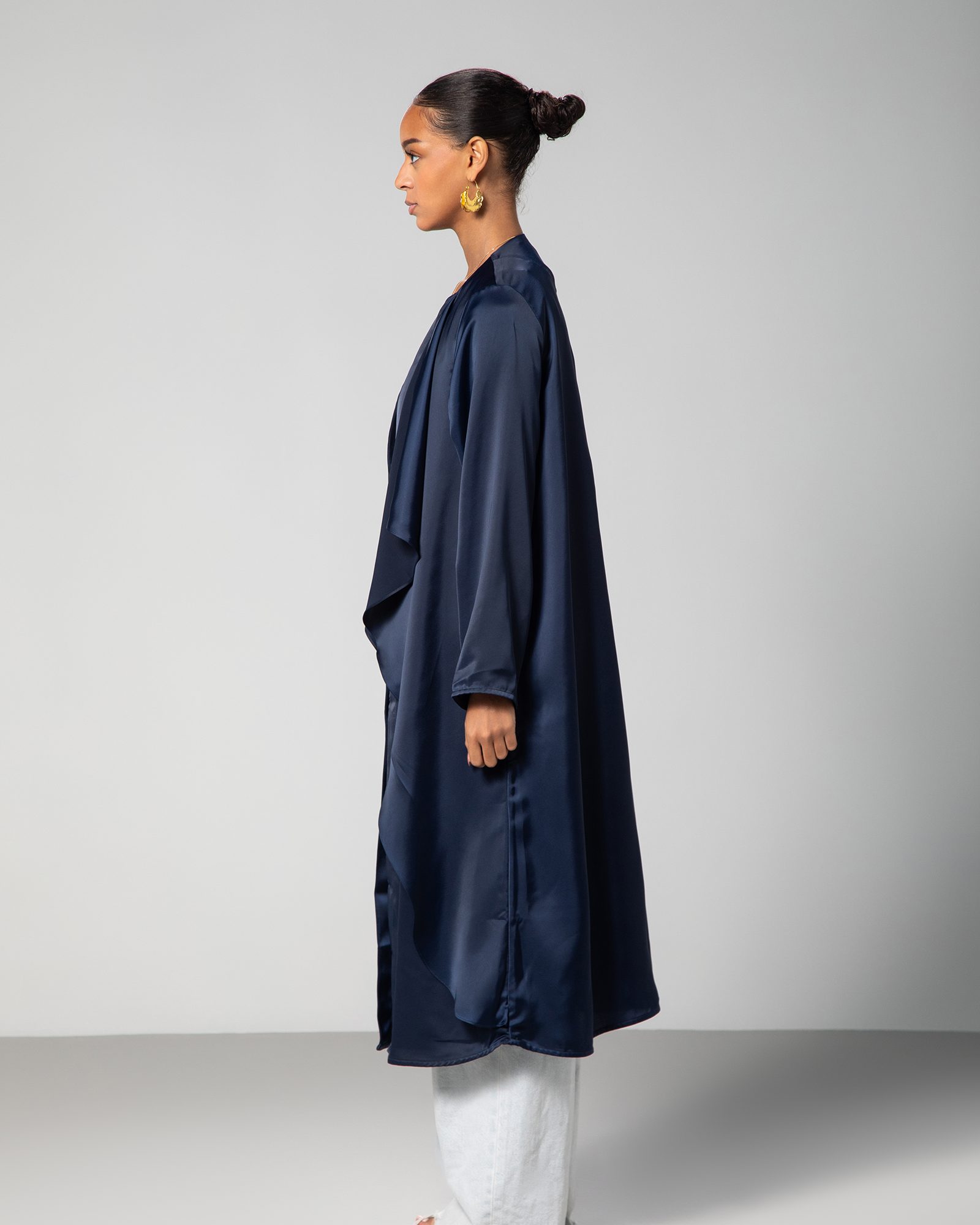 Side profile of the navy blue cover-up, highlighting the relaxed silhouette and mid-length cut KSA UAE Qatar