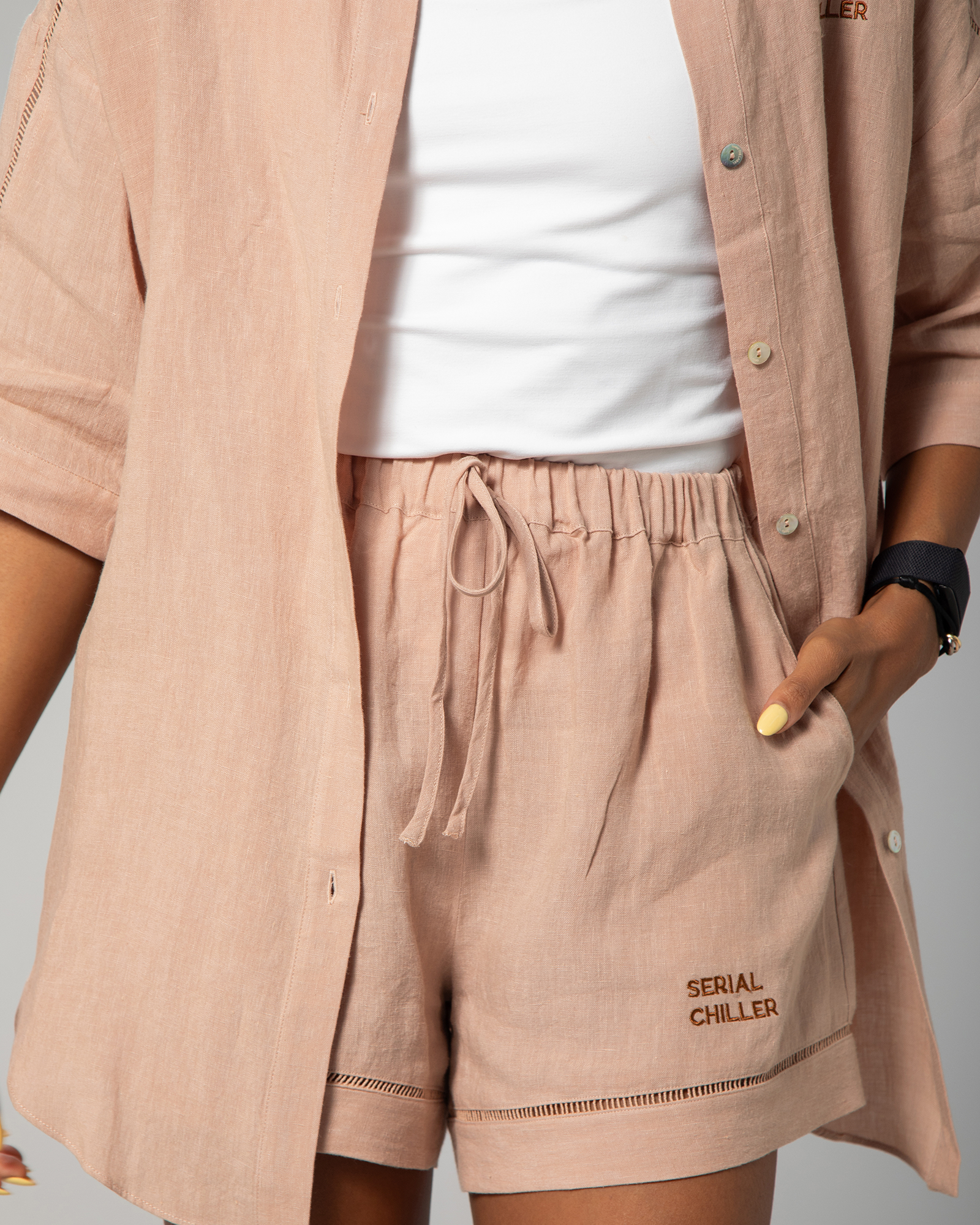 Close-up of nude linen shorts from Omni The Label, highlighting the natural fabric texture, elasticated waistband with drawstring, and relaxed silhouette designed for everyday comfort UAE KSA Qatar