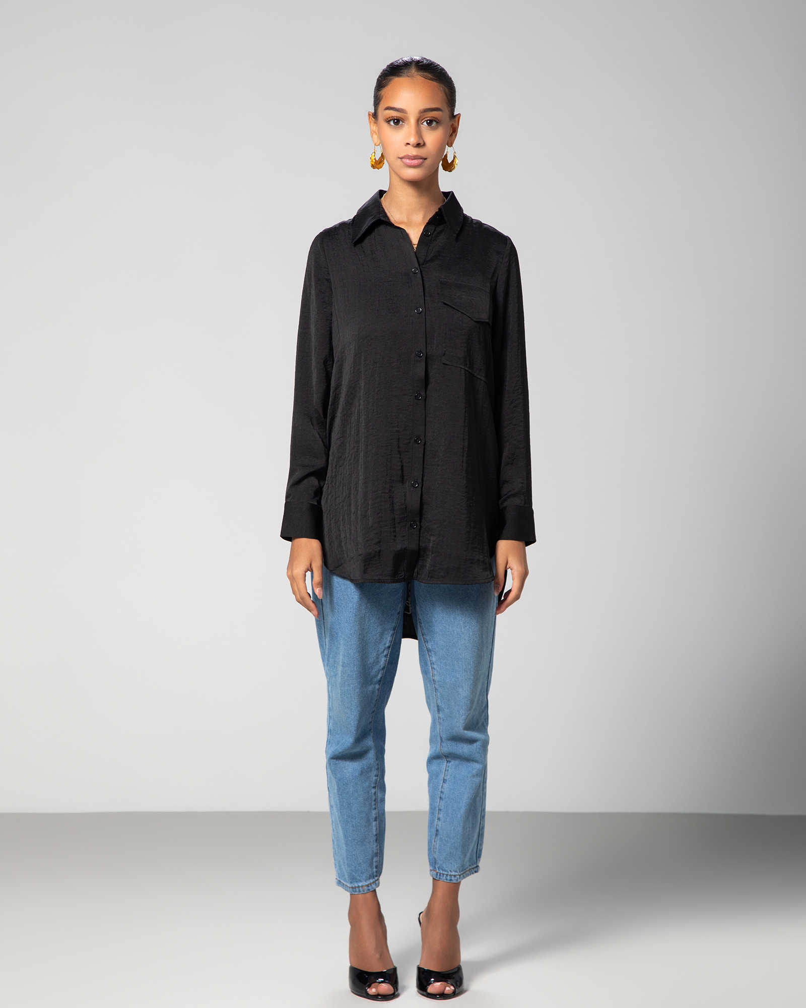 Full front view of model wearing the modern black collared shirt by Omni The Label – UAE, KSA, Qatar