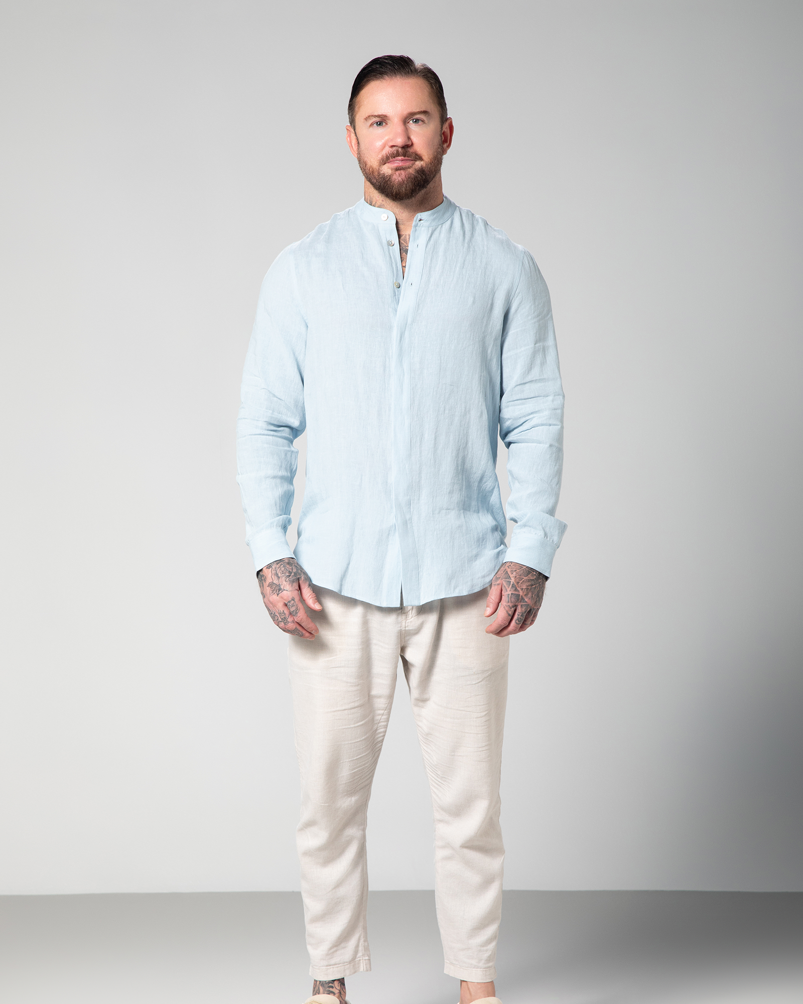 Front view of classic blue linen shirt for men by Omni The Label with discreet hidden buttons