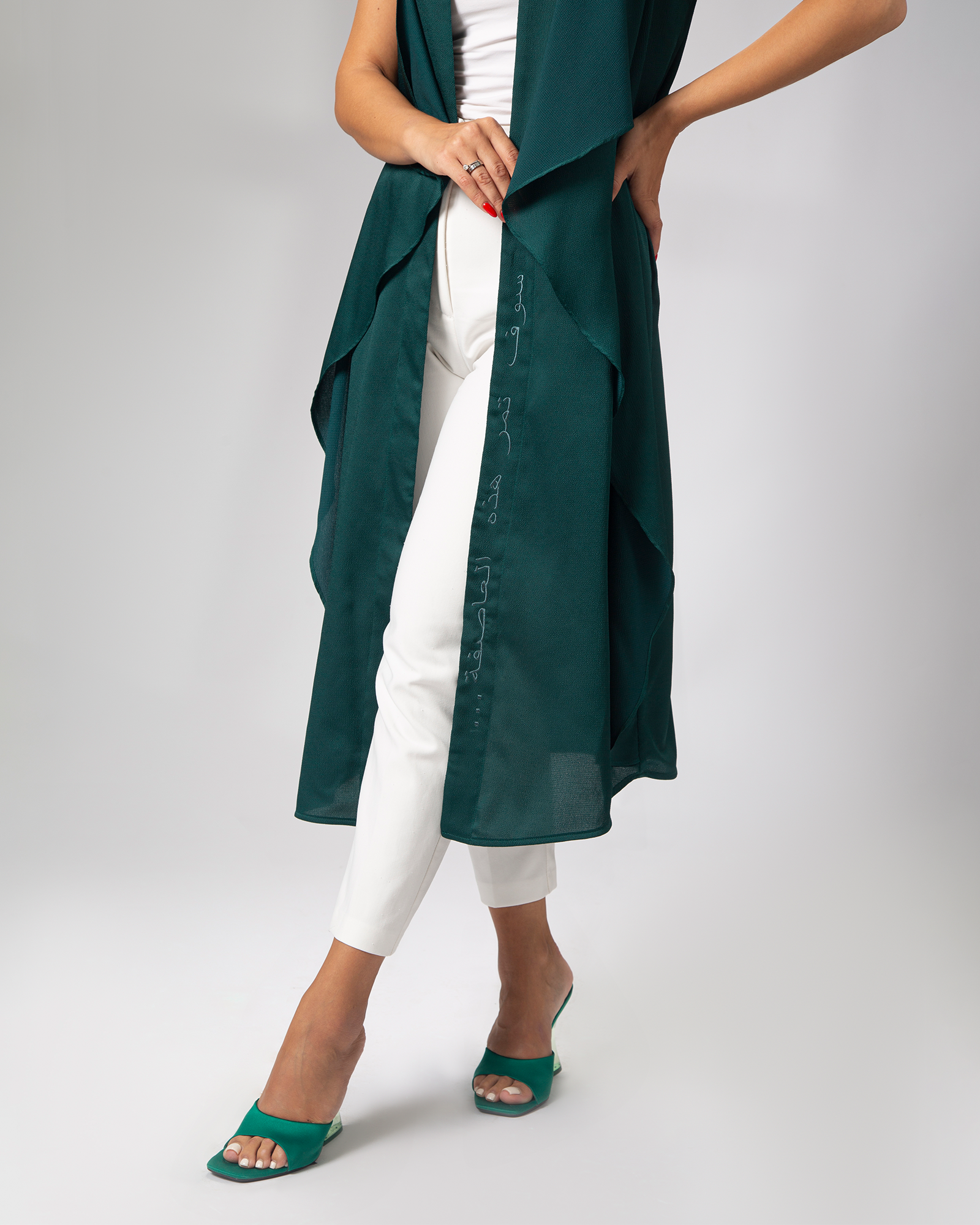 Green kimono-style cover-up shown mid-step, highlighting length and cut – UAE, KSA, Qatar