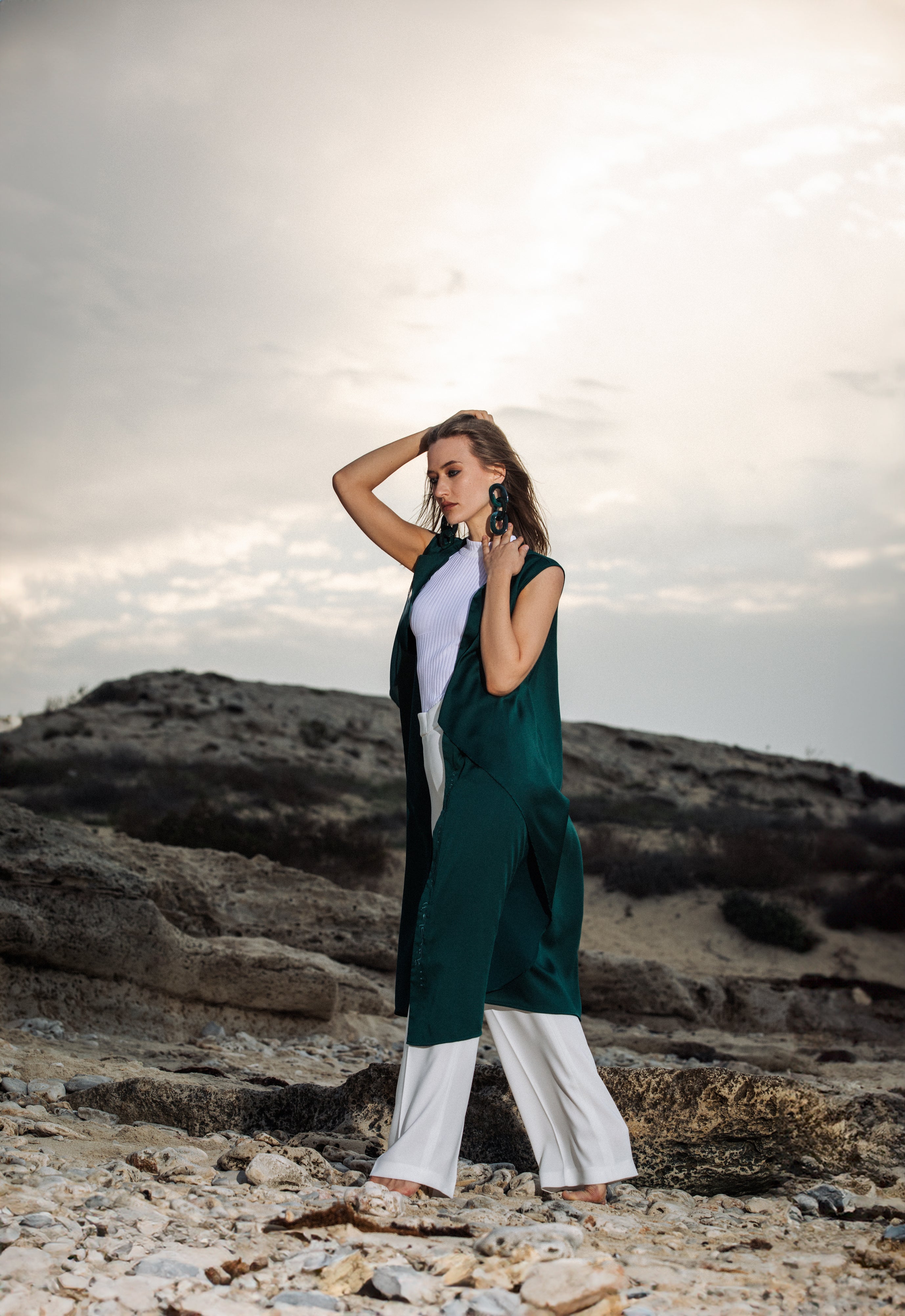 Green sleeveless cover-up worn in outdoor setting, styled for modest summer look – UAE, KSA, Qatar