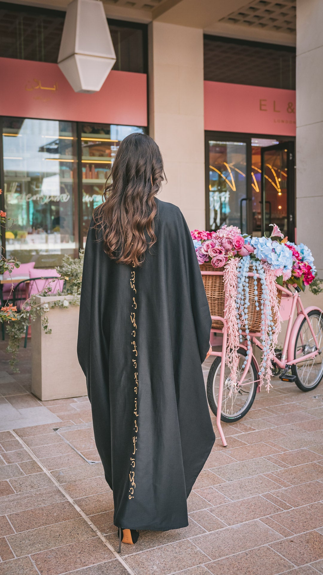 Black linen abaya with arabic caligraphy embroidered on the back in gold thread, long sleeve kaftan cover up