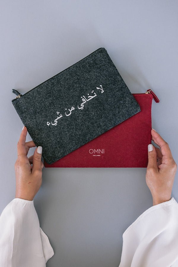 Pouch in grey and burgundy one side print with arabic quote Fear Nothing UAE KSA Qatar