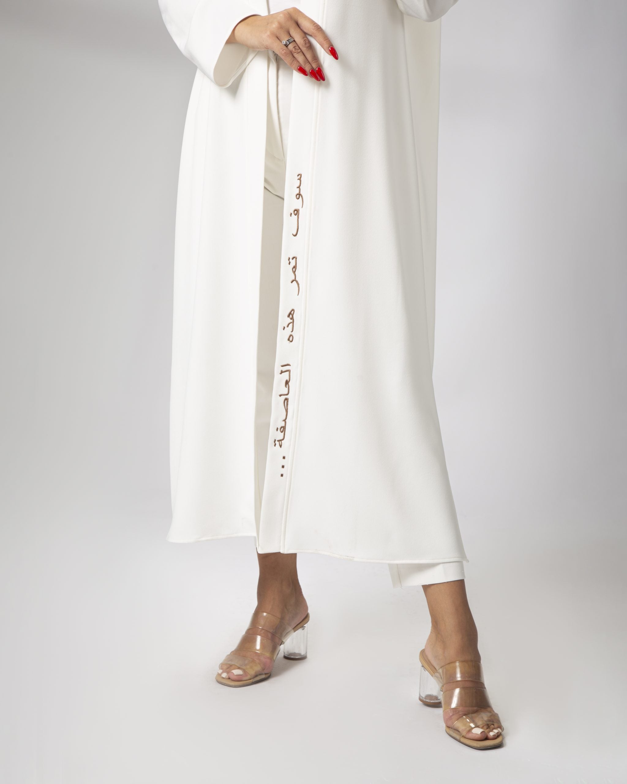 Detail view of white kimono front embroidery open front style by Omni The Label popular in Qatar UAE and KSA