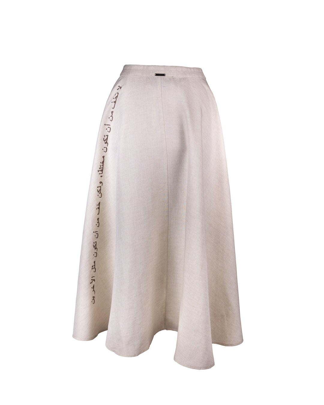 Beige skirt with light brown buttons and Omni The Label tag, modest silhouette worn in UAE, Qatar, KSA