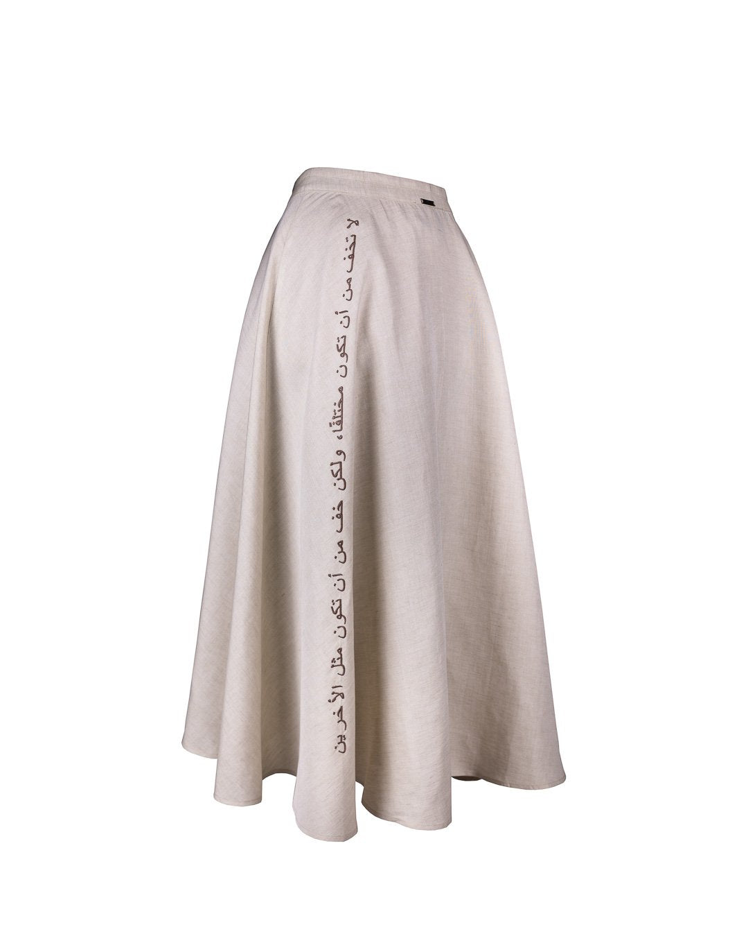 Flat lay of the beige Next Wednesday Skirt by Omni The Label, showcasing button detail and signature cut.KSA UAE Qatar