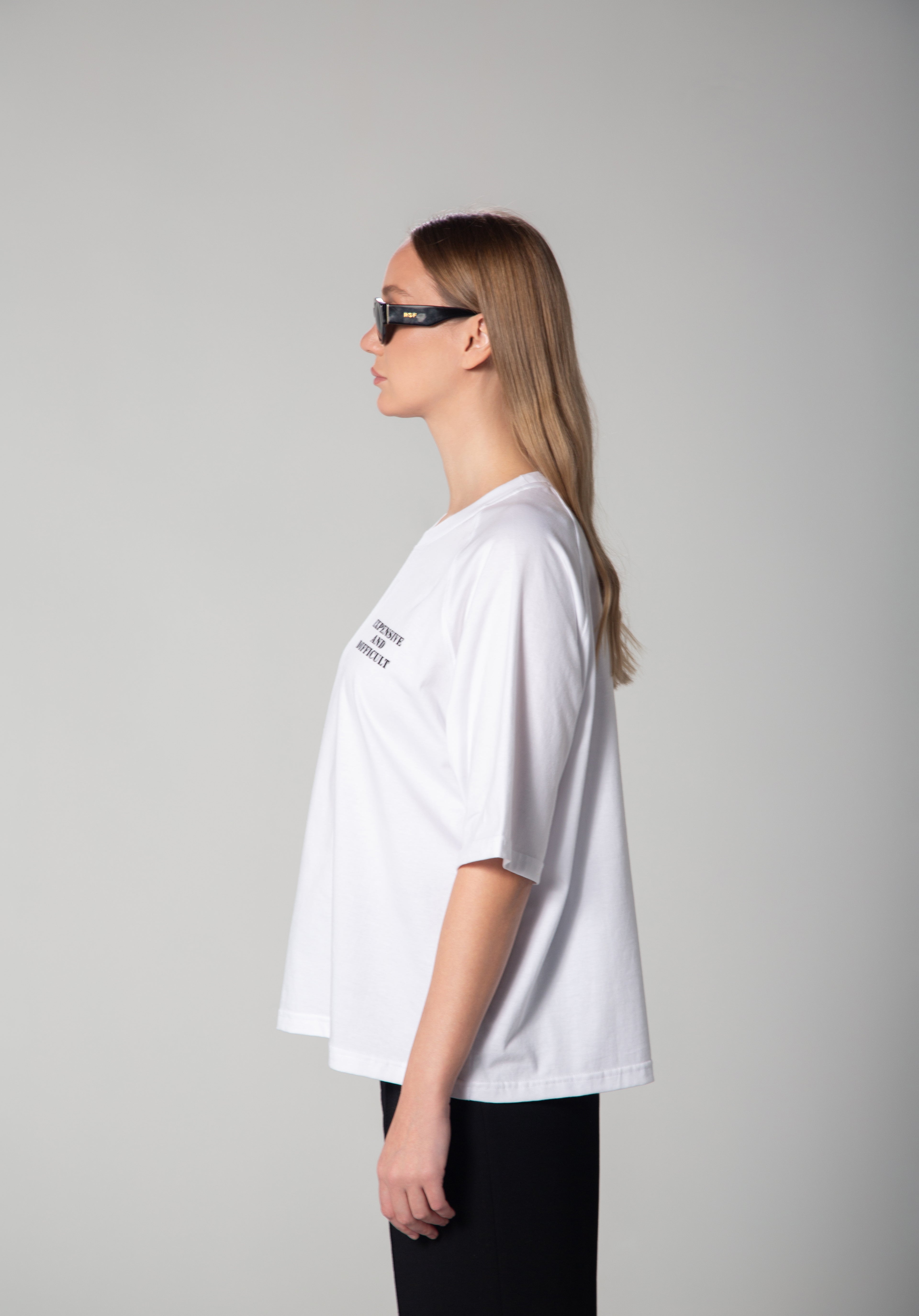 A trendy oversized t-shirt with "Expensive & Difficult" printed on the front. Loose-fitting with a casual yet edgy vibe, perfect for everyday wear.