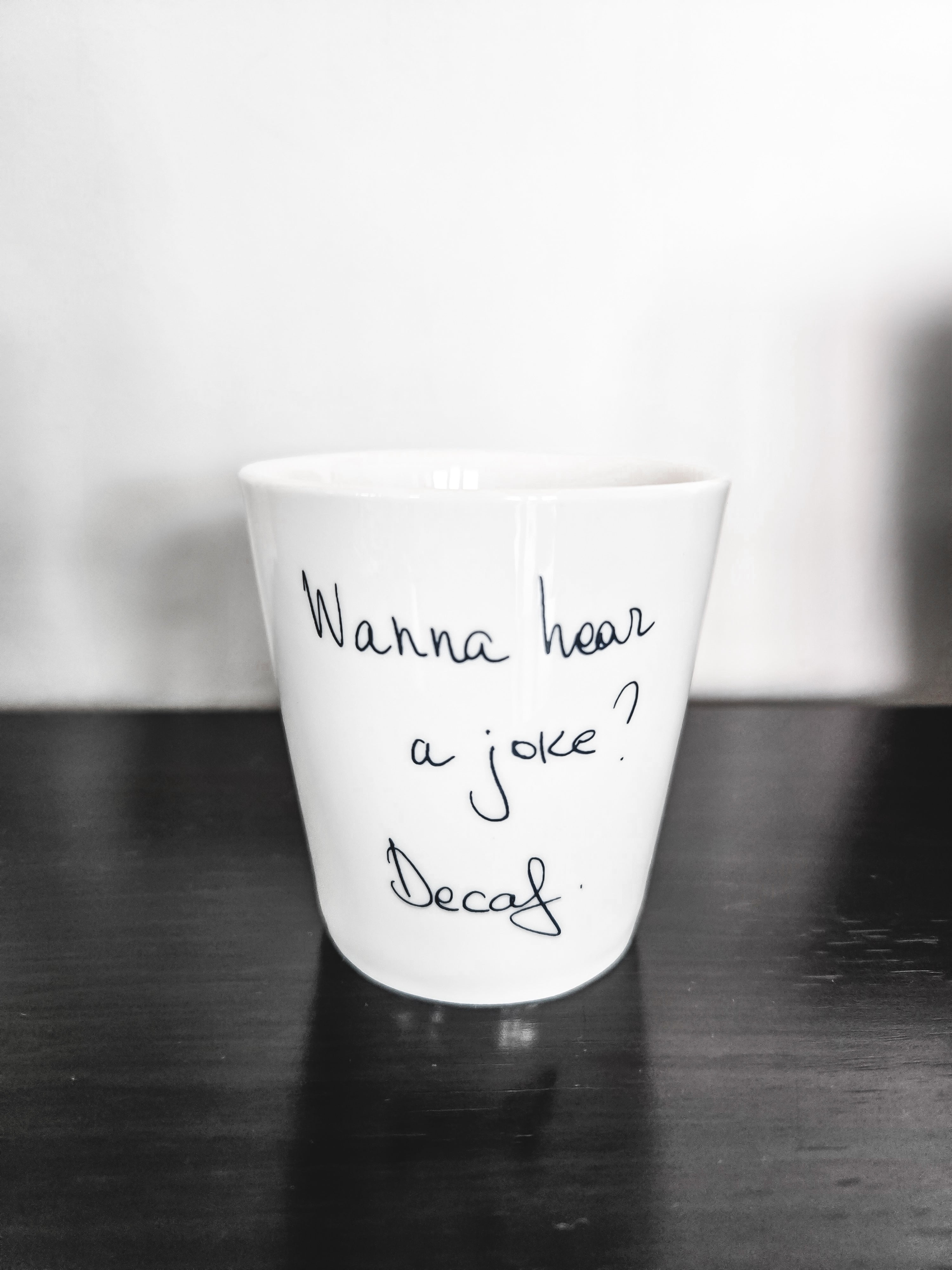 "Wanna hear a joke? " coffee cup