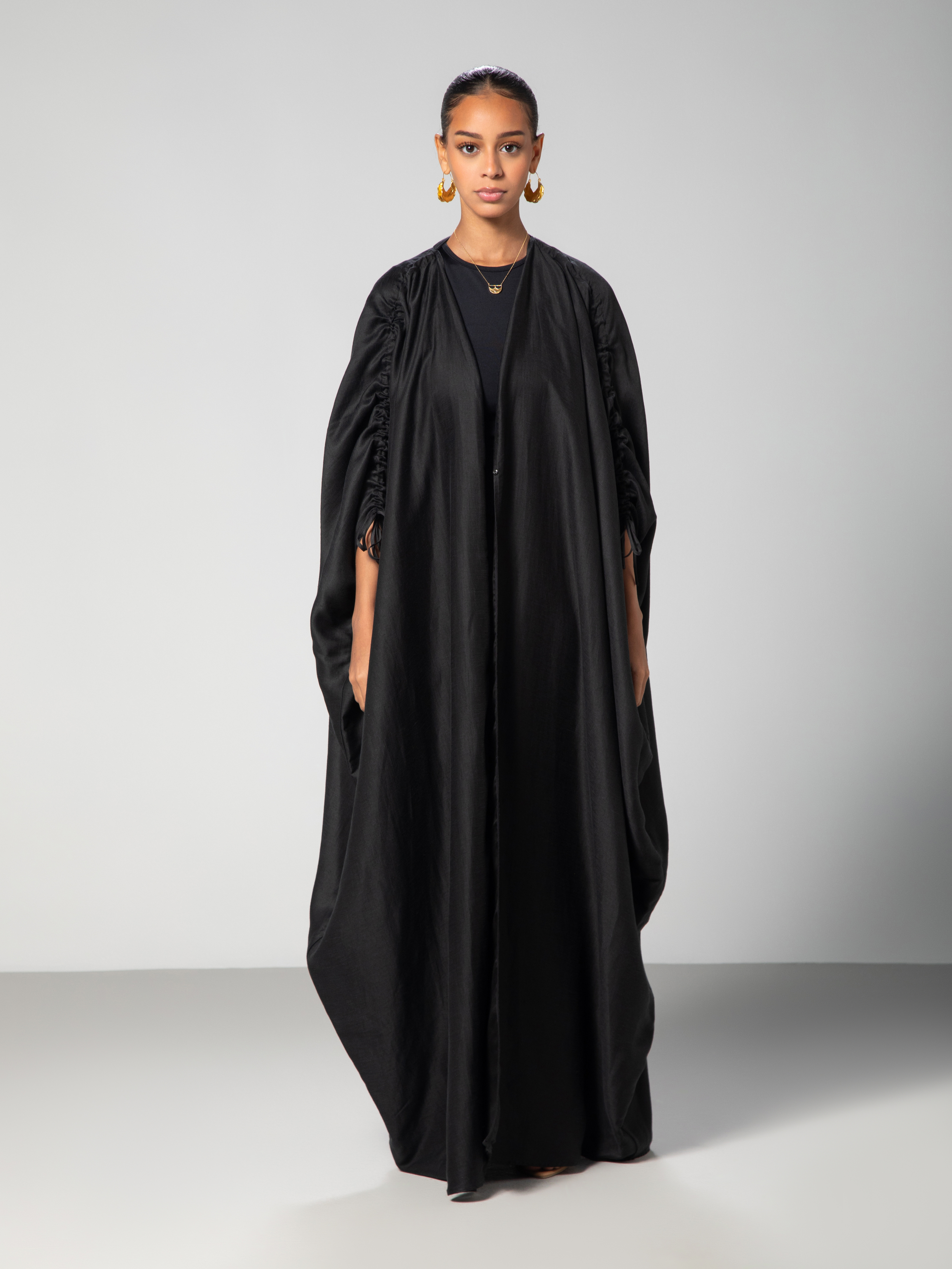 Abaya with adjustable sleeves