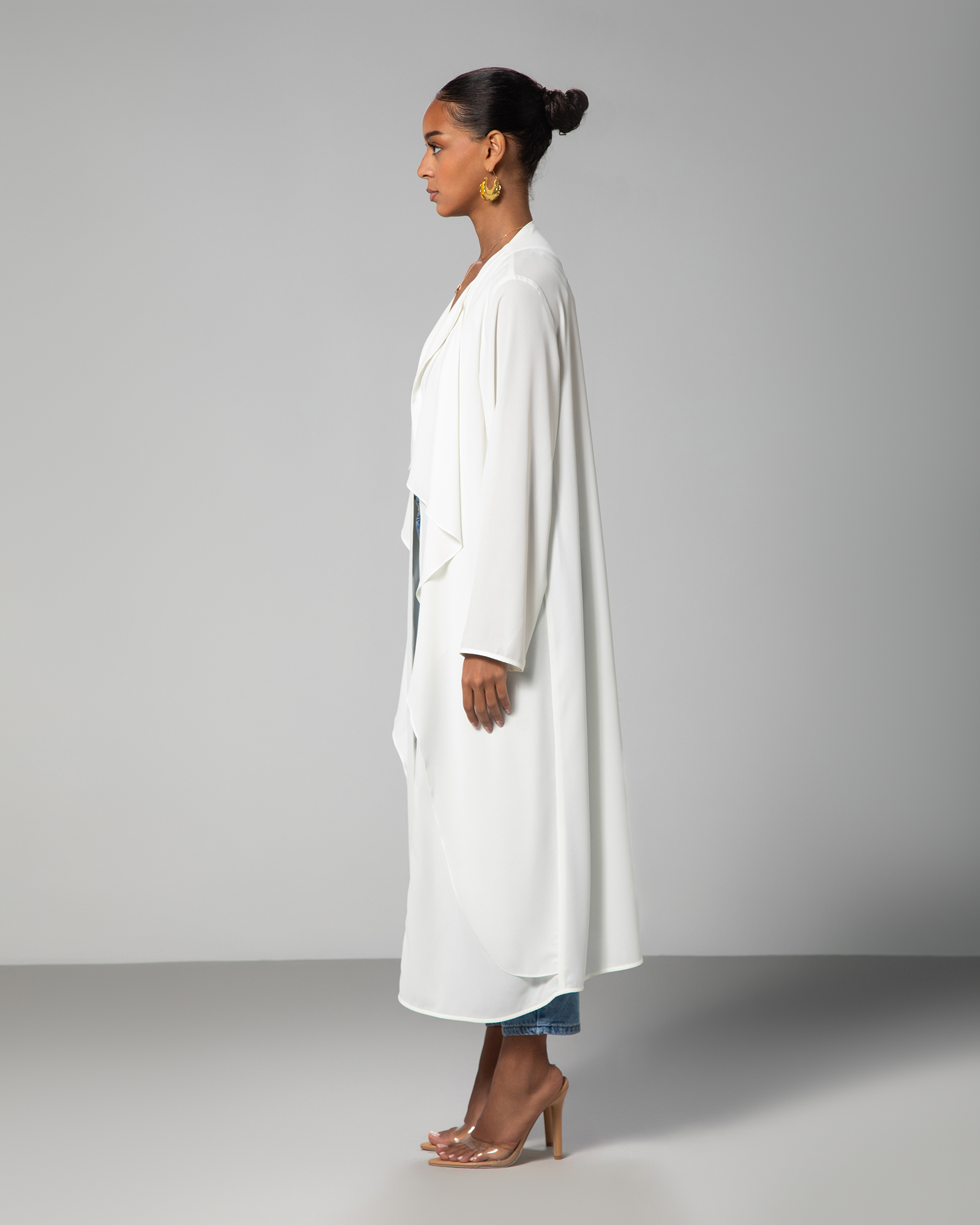 Side angle of The 4pm Cover Up in White showing relaxed fit and flowy cut