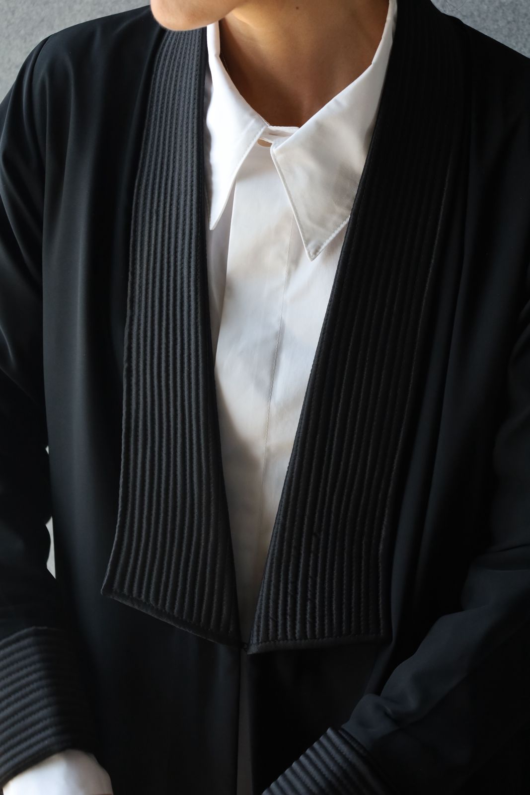 Huwaila Abaya – classic black abaya with pleated collar and cuffs, timeless modest fashion by Omni The Label  Qatar UAE KSA