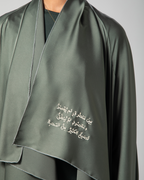 Close-up of Arabic calligraphy on Omni The Label’s Flow Abaya in sage green – UAE, KSA, Qatar