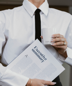 Person holding a document titled 'Executive Summary' and a cup.
