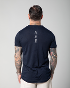 Omni The Label’s blue men’s T-shirt featuring “Who seeks, finds” Arabic embroidery along the back seam, combining comfort with intentional design UAE KSA Qatar

