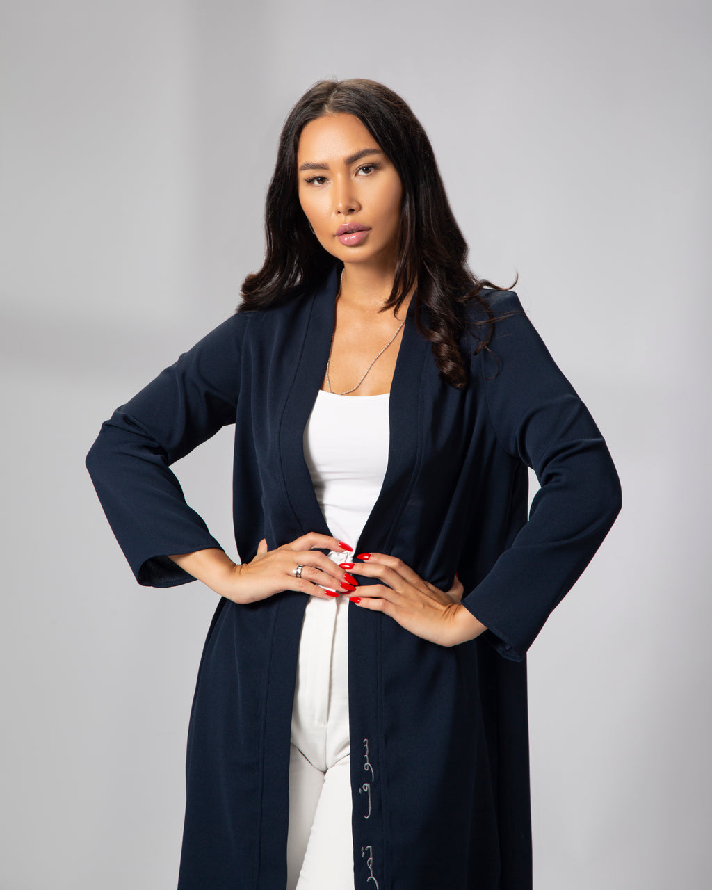 Close-up of the navy blue kimono, showing embroidery detail on front left panel and open sleeve cut KSA UAE Qatar