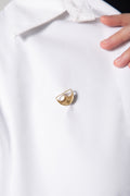 Close-up of The Batoolah Brooch 18K Gold styled on a white shirt, showcasing the 18K solid gold finish and its elegant cultural silhouette KSA UAE Qatar