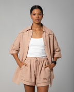 Neutral-toned linen co-ord from Omni The Label with polished mother-of-pearl button closure, blending luxury detail with everyday comfort UAE KSA Qatar