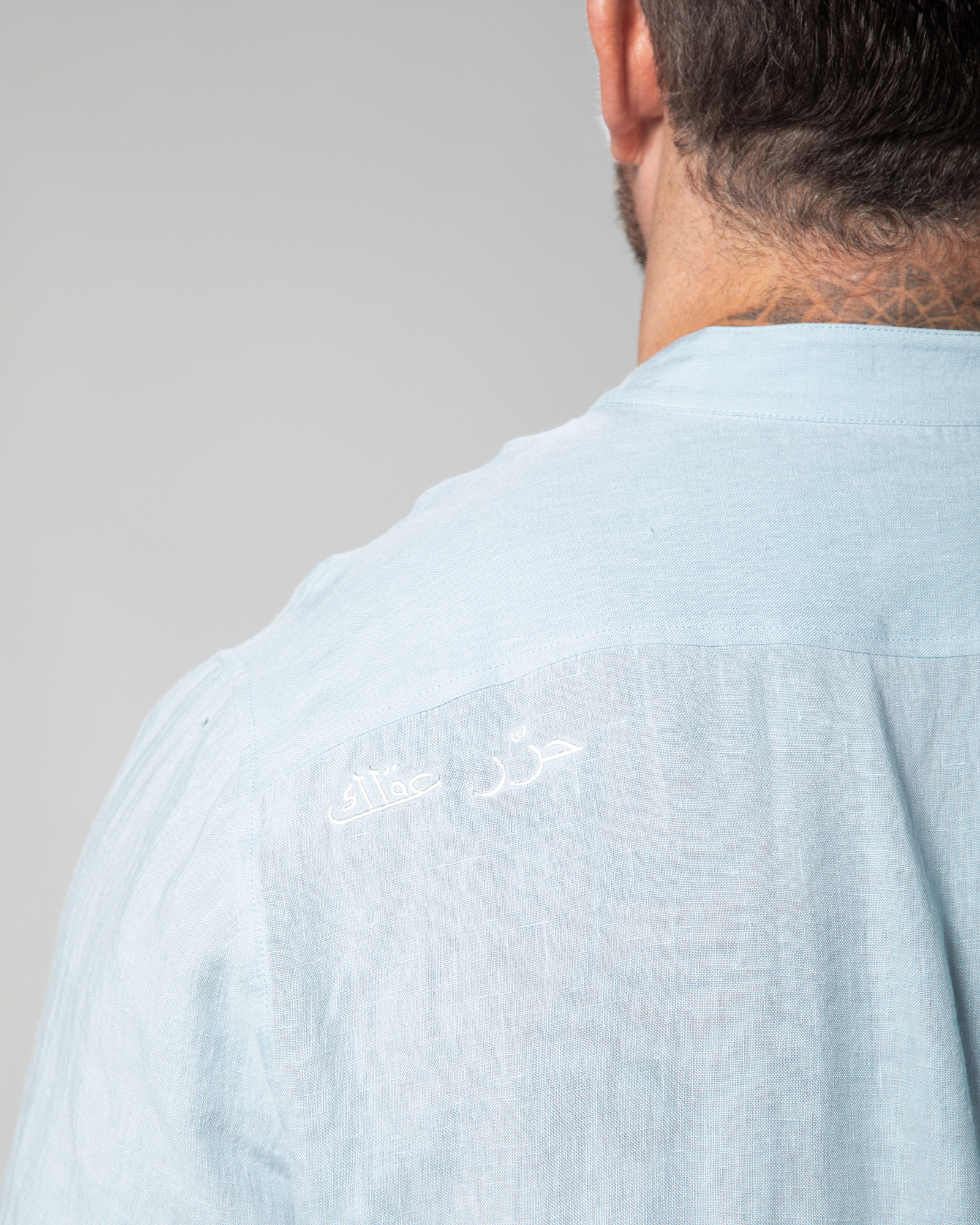 Close-up of Arabic embroidery "Free Your Mind" 
