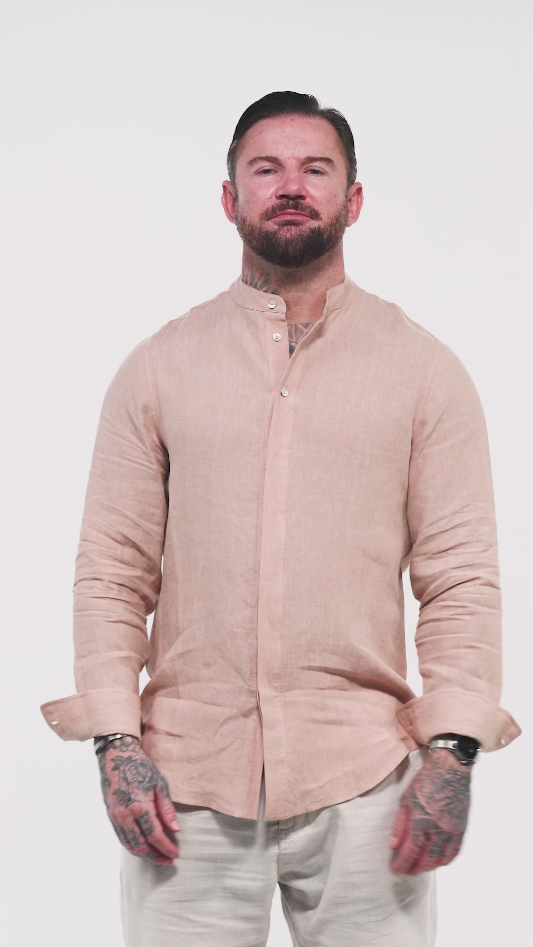 Watch the St. Tropez linen shirt in motion — a refined nude-colored design tailored for comfort and effortless style. The video highlights the sleek collar, partially hidden front buttons, and the meaningful Arabic embroidery on the back reading “Free Your Mind.” A breathable staple piece from Omni The Label’s menswear line Male model  in the Marbella nude T-shirt by Omni The Label with Arabic embroidery reading this too shall pass shown in motion to highlight soft lightweight slub jersey fabric KSA UAE 