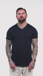 Discover the Marbella Men’s V-neck T-shirt in blue — a timeless essential by Omni The Label. Made from 100% slub jersey for maximum breathability, this lightweight T-shirt offers both comfort and character. The video features the shirt in motion, emphasizing its effortless drape and signature Arabic embroidery on the back UAE KSA Qatar