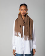 Cashmere-look scarf worn long-line over white shirt and denim, showcasing elegant drape – UAE, KSA, Qatar