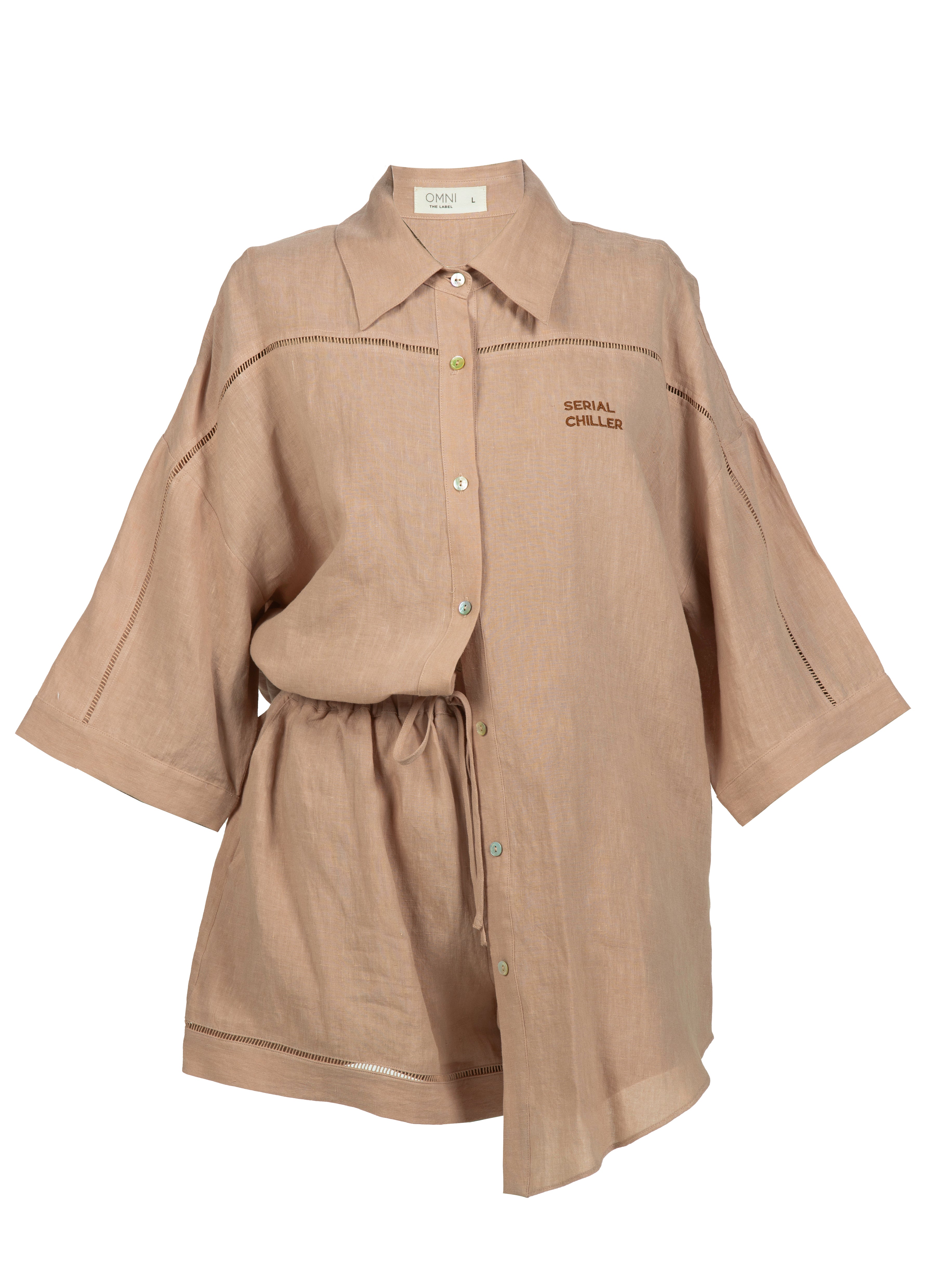 Close-up of nude linen shirt and pants from Omni The Label featuring elegant mother-of-pearl buttons and relaxed tailoring, perfect for timeless summer style UAE KSA Qatar