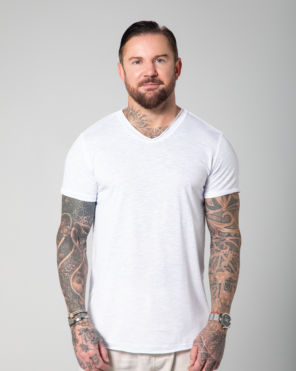 Front view of the Marbella white V-neck T-shirt for men, highlighting the soft slub texture and clean, minimal cut.UAE, KSA, Qatar
