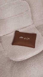 minimalist bag with quote free your mind on a white minimalistic couch UAE, KSA, Qatar